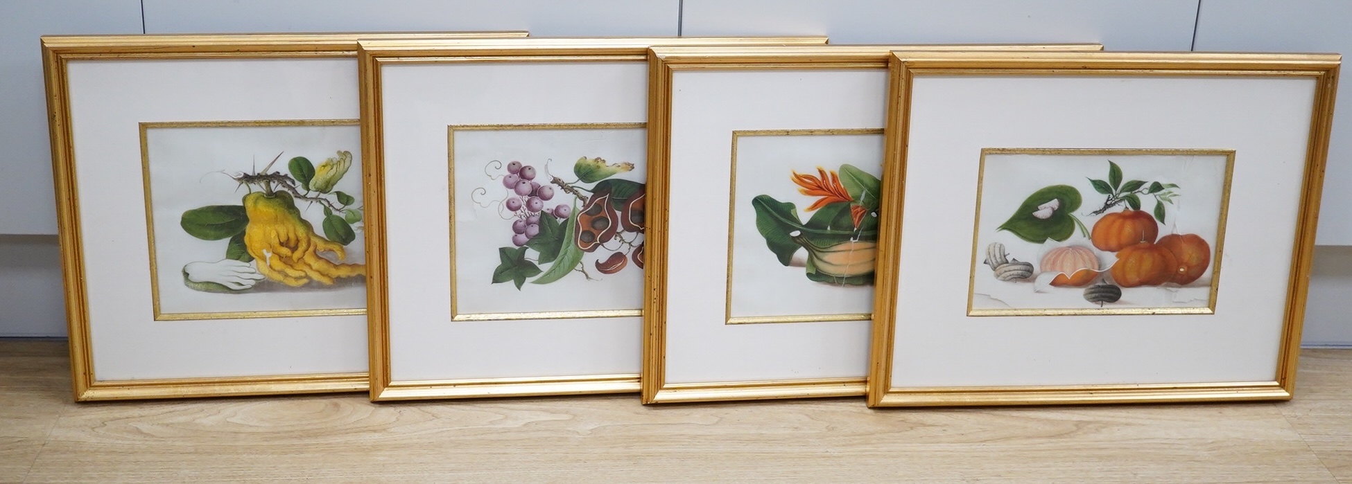 Mid 19th century, Chinese School, set of four pith paintings, Still lifes of fruit and vegetables, 18 x 26cm. Condition - poor, rips to the paper